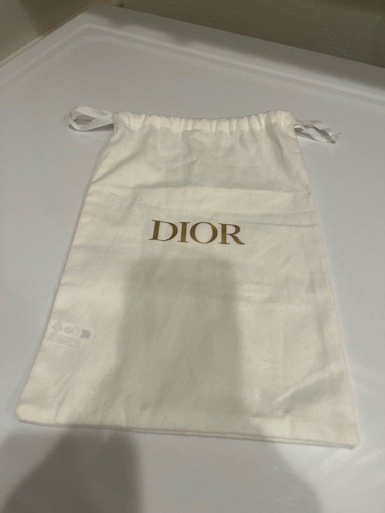 Dior Handbags - Dior White Drawstring Bag with Gold DIOR Logo